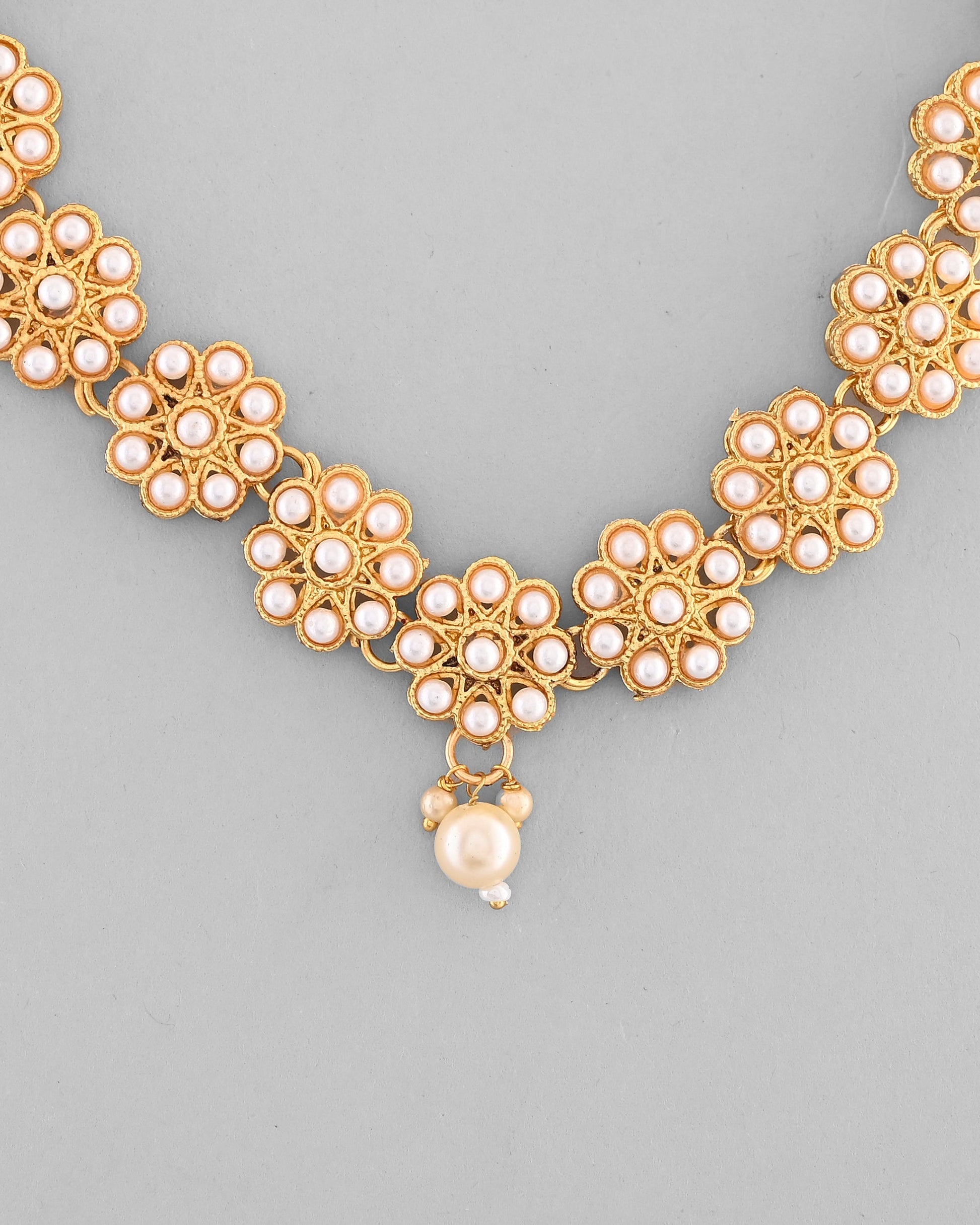 VOJ Gold-Polished Pearl Studded Floral Necklace And Earrings VOJ (Valley Of Jewellery)