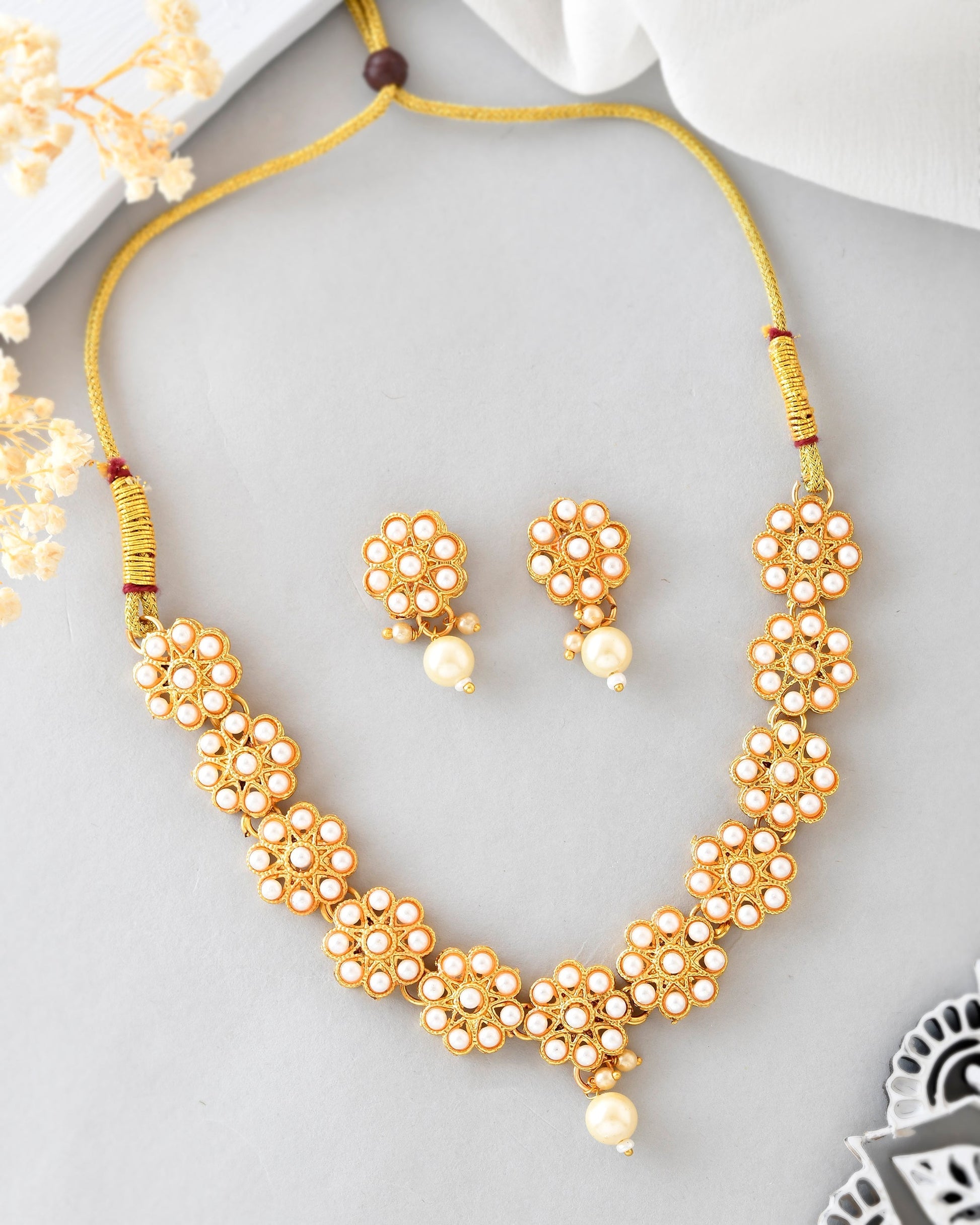 VOJ Gold-Polished Pearl Studded Floral Necklace And Earrings VOJ (Valley Of Jewellery)