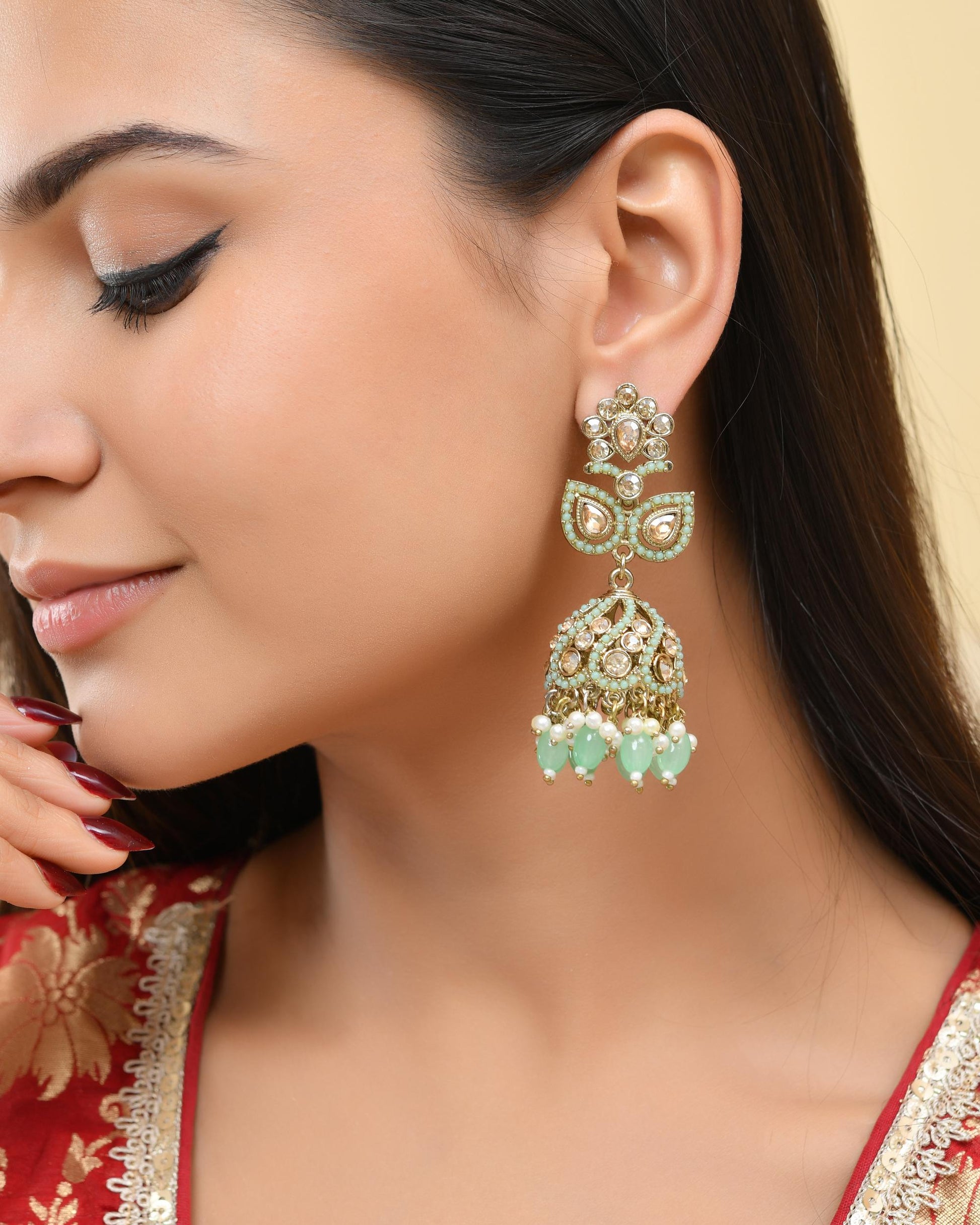VOJ Mint Green Stone Studded Gold-Polished Jhumkas VOJ (Valley Of Jewellery)