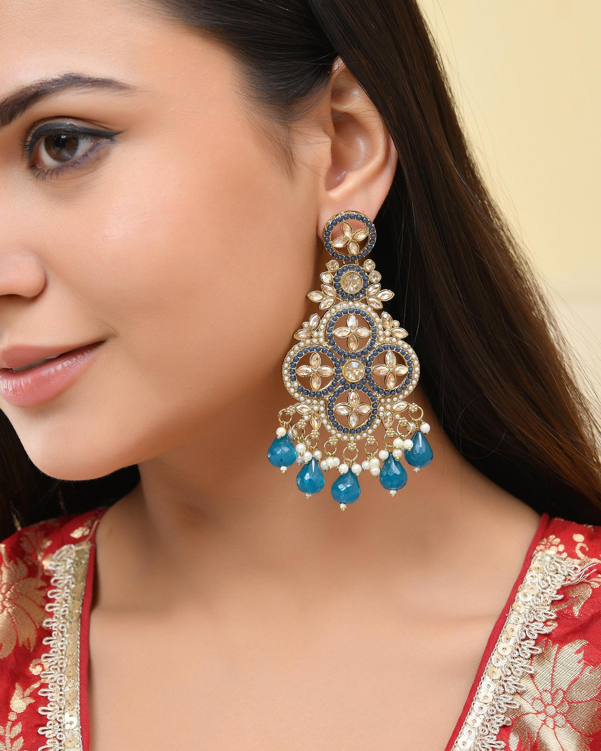 VOJ Blue Stone Studded Gold-Polished Crescent Shaped Earrings VOJ (Valley Of Jewellery)