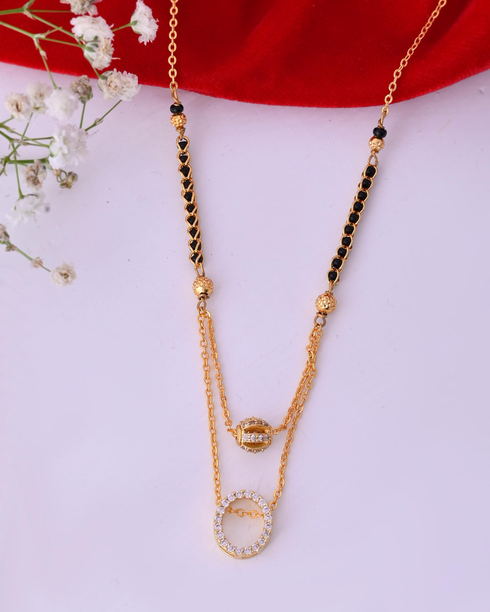 VOJ Gold-Polished Ad Studded Oval Shaped Mangalsutra 
