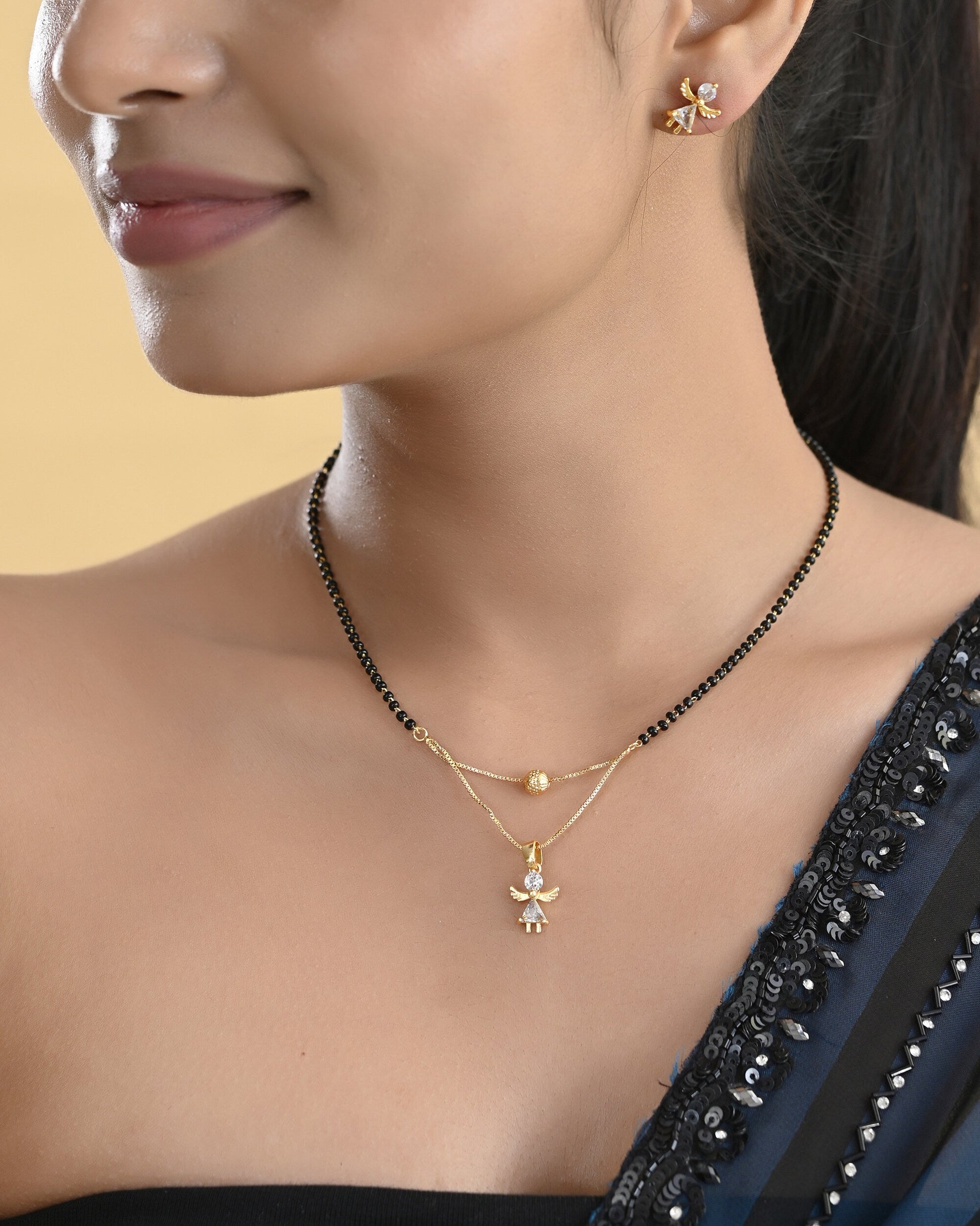 VOJ Gold-Polished Doll Shapped Stone Studded Mangalsutra With Earrings Set 