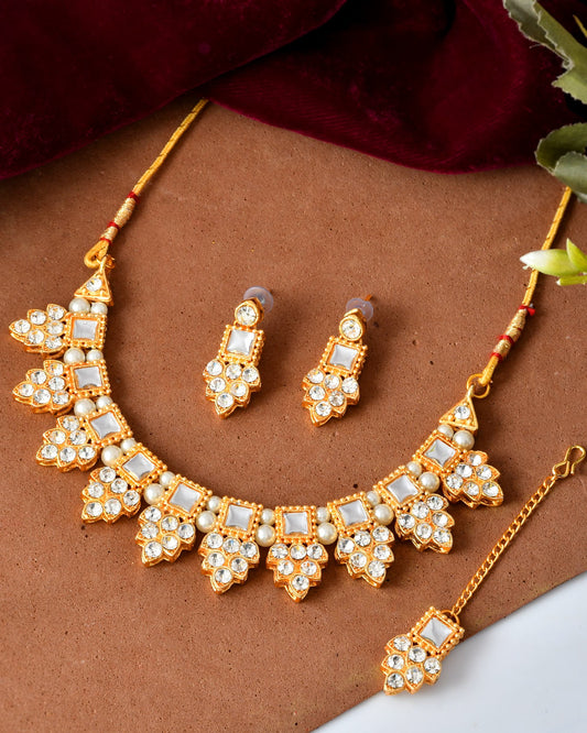 VOJ Gold Polished Stone Studded Necklace Set With Maang Tikka VOJ (Valley Of Jewellery)