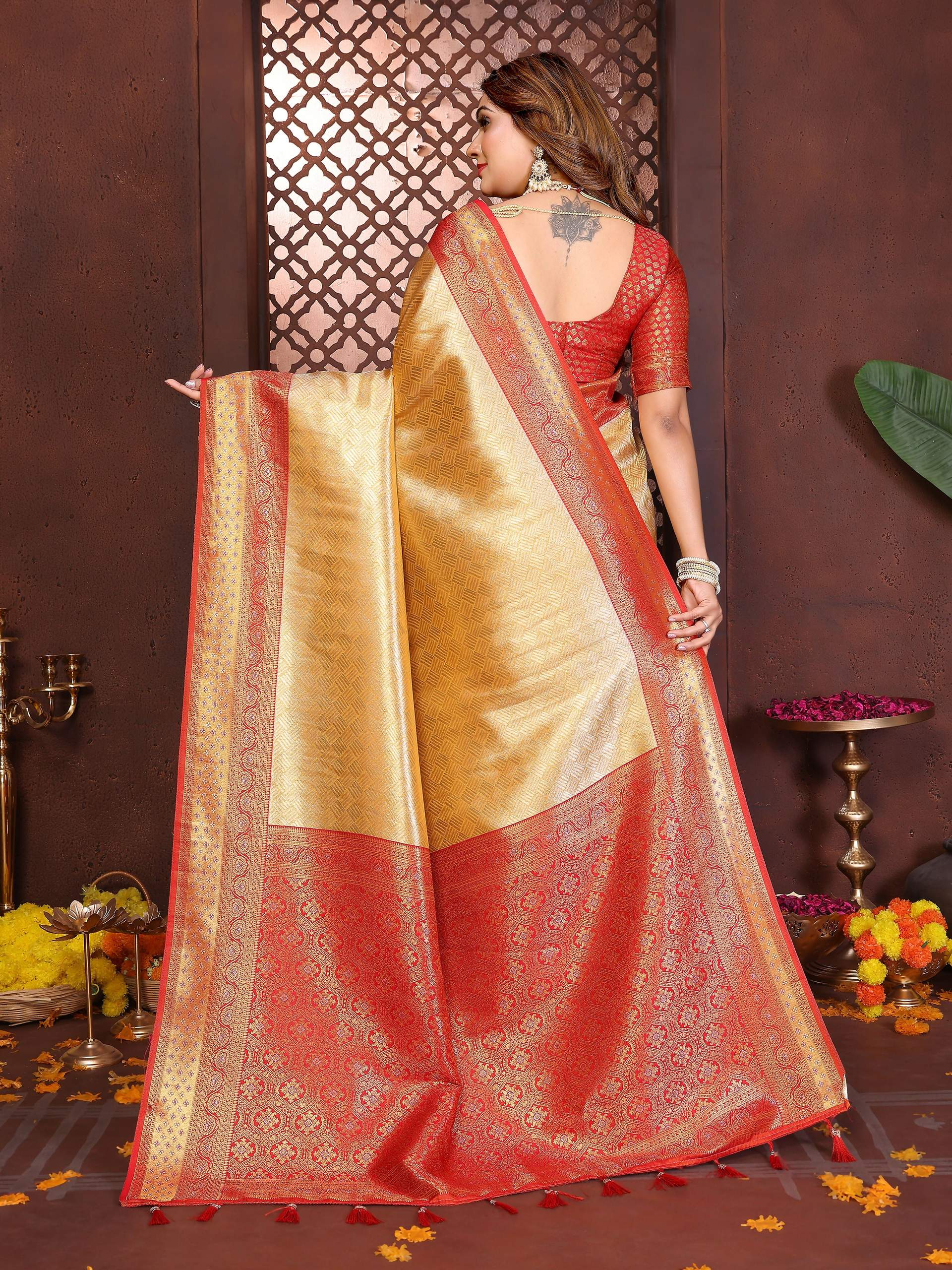 Aastha Fashion Cream Tissue Silk Woven Saree