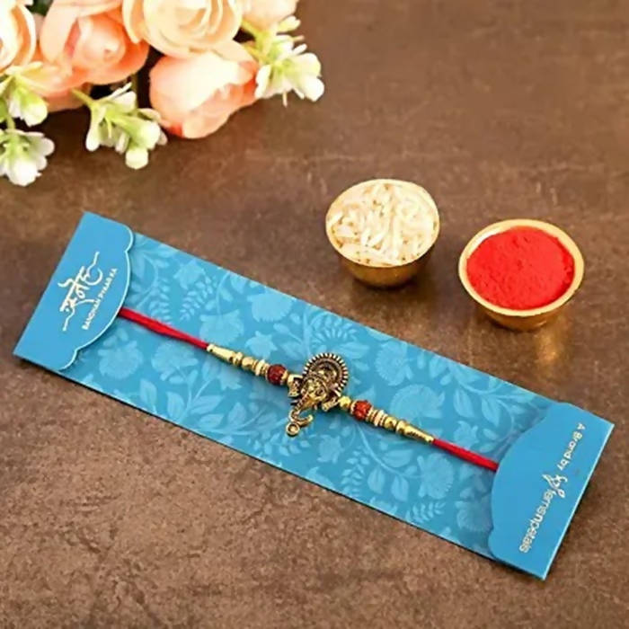 Lord Ganesha Rudraksha Rakhi & Kaju Roll Box