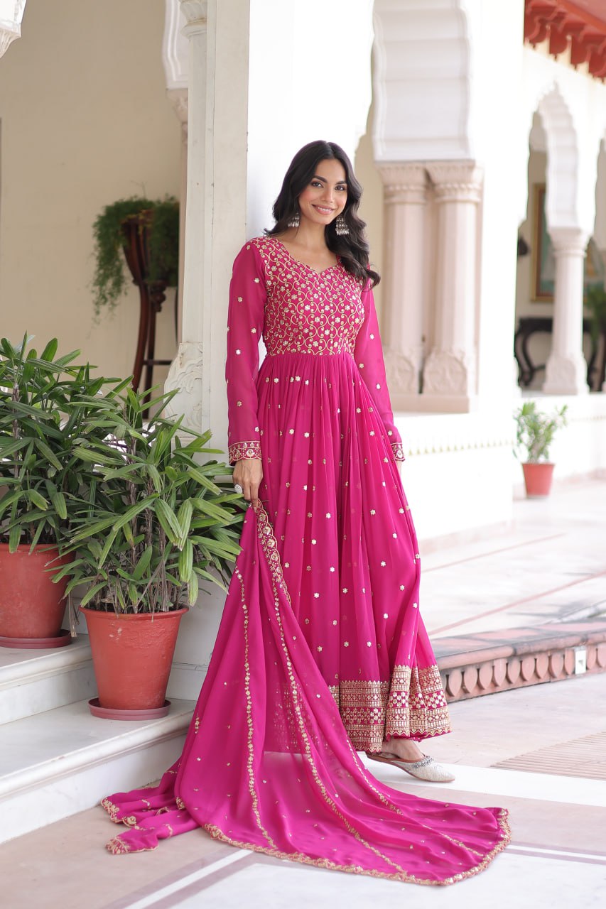 Evanik Rani Pink Faux Georgette with Rich Sequins & Zari Embroidered work Gown