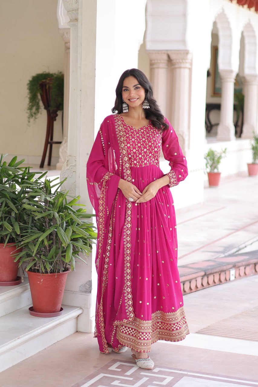 Evanik Rani Pink Faux Georgette with Rich Sequins & Zari Embroidered work Gown
