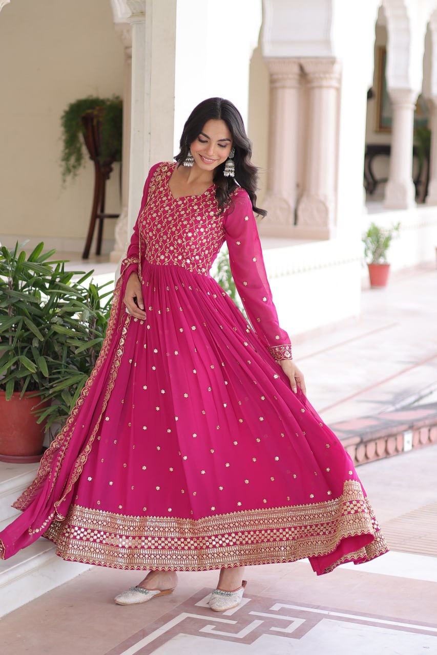Evanik Rani Pink Faux Georgette with Rich Sequins & Zari Embroidered work Gown