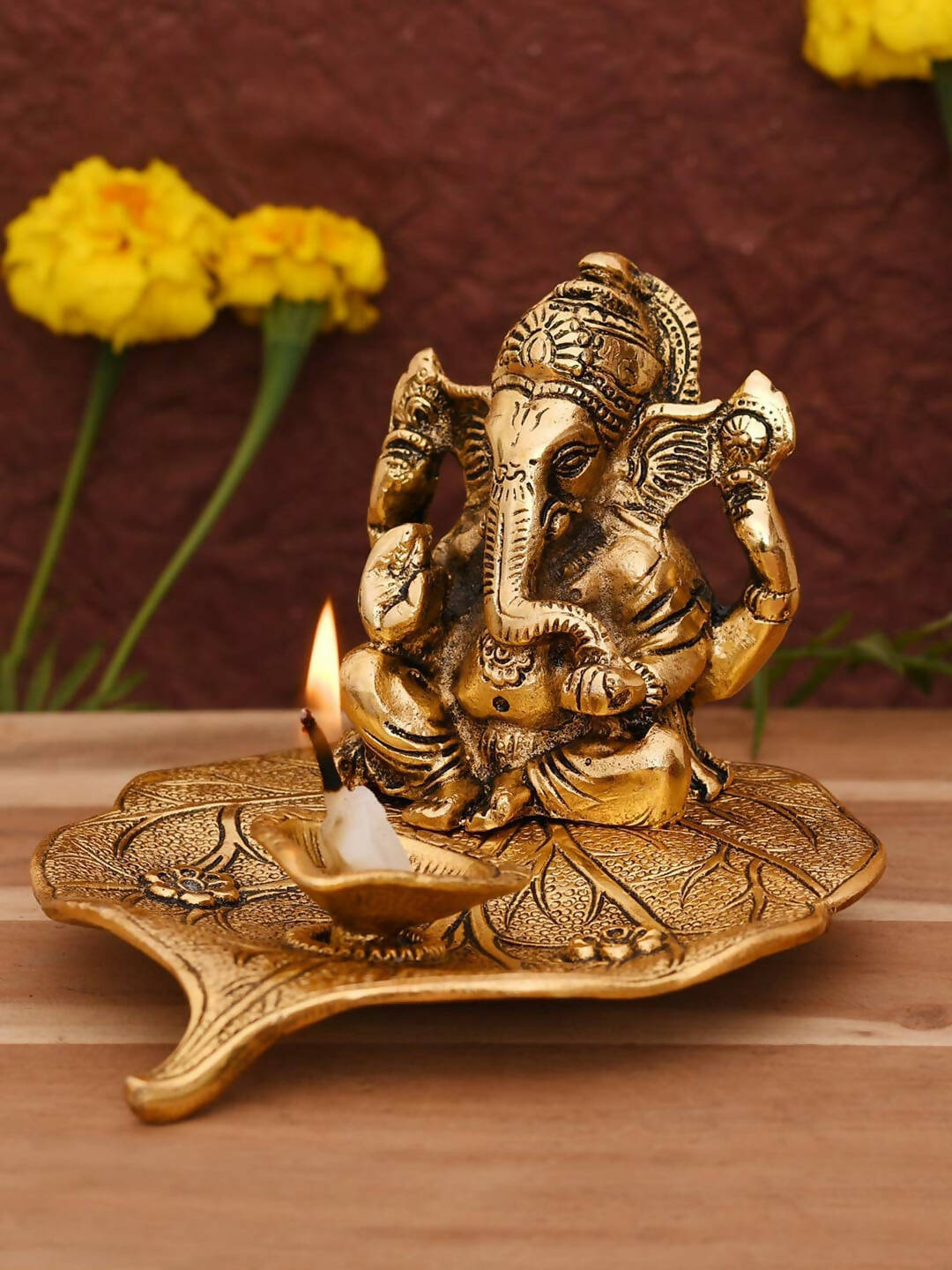 CraftVatika Gold Toned Aluminium Ganesh with Diya Idol 
