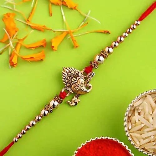 Auspicious Ganesha Rakhi And Almonds Jar